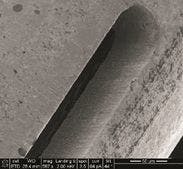 FIGURE 3. Examples of femtosecond laser cutting of fine features include a 50µm slot in 250µm OD nitinol tubing (top), 50µm relief holes for flexible tubing (center), and edge quality of a nitinol stent processed with only ultrasonic bath cleaning (bottom). FIGURE 3. Examples of femtosecond laser cutting of fine features include a 50µm slot in 250µm OD nitinol tubing (top), 50µm relief holes for flexible tubing (center), and edge quality of a nitinol stent processed with only ultrasonic bath cleaning (bottom).
