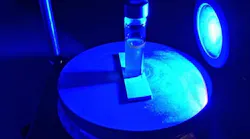 A blue LED shines on a vial containing heavy water, a pharmaceutical compound, and a light-activated catalyst. Princeton chemistry professor David MacMillan and colleagues have developed a new photocatalytic approach to hydrogen isotope exchange (HIE) that turns a multi-month process into a one-day step, speeding the arrival of new drugs to the marketplace.