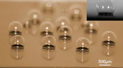 A chip-scale glass microspherical shell sensor array is shown blown on a silicon substrate. Insert is a near-perfect spherical shell.