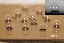 A chip-scale glass microspherical shell sensor array is shown blown on a silicon substrate. Insert is a near-perfect spherical shell. A chip-scale glass microspherical shell sensor array is shown blown on a silicon substrate. Insert is a near-perfect spherical shell.