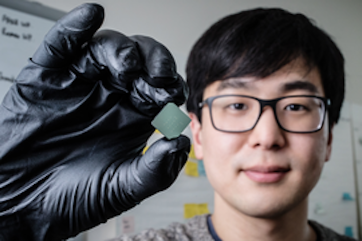 Mechanical science and engineering student and lead author of a new study Benjamin Sohn holds a device that uses sound waves to produce optical diodes tiny enough to fit onto a computer chip. (Image credit: University of Illinois at Urbana-Champaign)