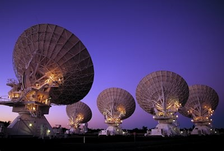 Australian researchers sent a reference signal between two radio telescopes using a 155 km fiber-optic telecommunications link. The new technique passively compensates for network signal fluctuations introduced by environmental factors such as temperature changes or vibrations, and can replace the use of atomic clocks. (Image credit: D. Smyth, CSIRO)