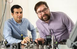 Alireza Marandi, left, and Marc Jankowski prepare to carry out experiments at the optical bench that generate better ultrashort pulses. Alireza Marandi, left, and Marc Jankowski prepare to carry out experiments at the optical bench that generate better ultrashort pulses.