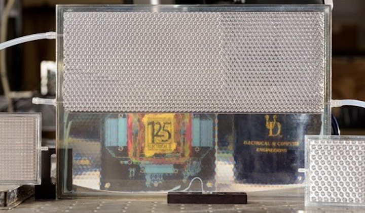 Electrical engineers at the University of Delaware developed their version of smart glass technology. It starts opaque but turns transparent when filled with index-matching fluid, as shown in the bottom portion of this pane. (Image credit: University of Delaware)