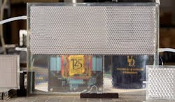 Electrical engineers at the University of Delaware developed their version of smart glass technology. It starts opaque but turns transparent when filled with index-matching fluid, as shown in the bottom portion of this pane. Electrical engineers at the University of Delaware developed their version of smart glass technology. It starts opaque but turns transparent when filled with index-matching fluid, as shown in the bottom portion of this pane.