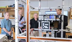 Brian Gunter of Georgia Tech shows the small satellite testing facilities in his lab to Xenesis leadership. Shown (l-r) are Neal Campion, Xenesis Strategy Director; Mark LaPenna, Xenesis CEO and founder; Mike Carey, chief strategy officer at Atlas Space Operations, and Gunter.
