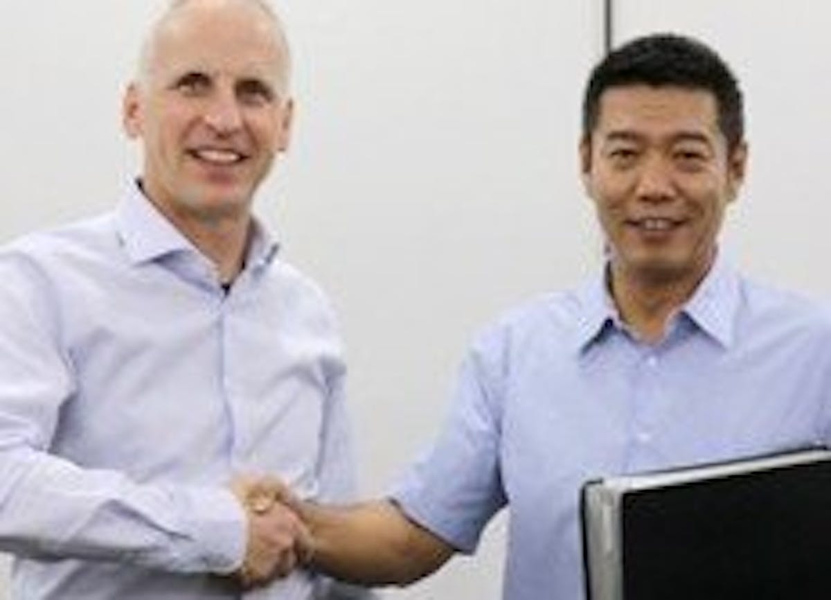 Dietmar Ley, CEO, Basler AG (left); Guan Qunli, chairman of Sanbao Xingye (right).