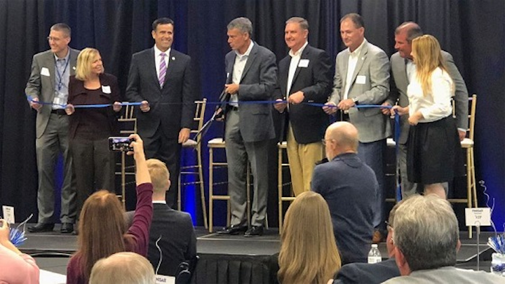 Finisar CEO Michael Hurlston cuts the ribbon at the company's new Sherman manufacturing plant on July 9, 2018. (Image credit: KTEN)