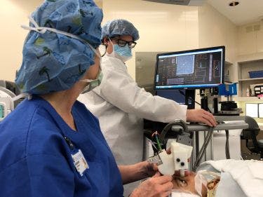 A new handheld ophthalmology instrument allows imaging of photoreceptors in the eyes of young children, as pictured here; it could help to improve the diagnosis of eye diseases and eventually find use in early detection of brain-related diseases and trauma.