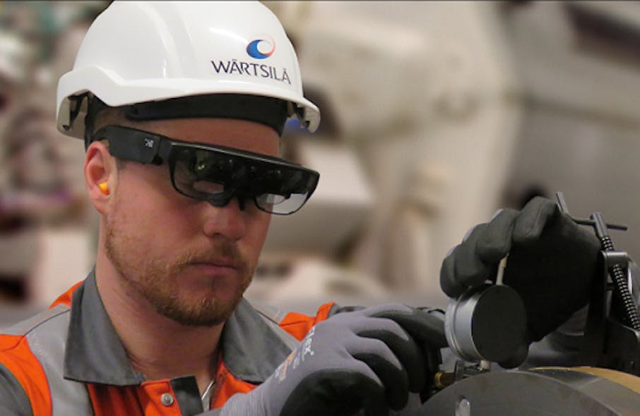A service engineer at W&auml;rtsil&auml; is using smart glasses when carrying out maintenance work.
