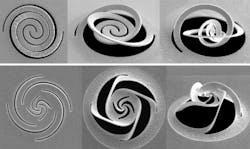 A focused ion beam slices through thin metal foil and the different patterns cause the metal to fold into predetermined shapes that can be used as optical elements for modifying and controlling light. A focused ion beam slices through thin metal foil and the different patterns cause the metal to fold into predetermined shapes that can be used as optical elements for modifying and controlling light.