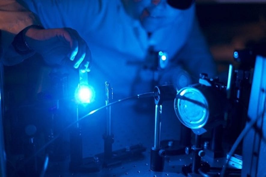 Doctoral student Kirsi Virkki prepares ultrafast laser spectrometer for the solar cell measurements.