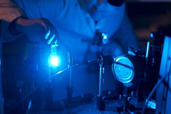 Doctoral student Kirsi Virkki prepares ultrafast laser spectrometer for the solar cell measurements. (Image credit: Tampere University of Technology)