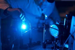 Doctoral student Kirsi Virkki prepares ultrafast laser spectrometer for the solar cell measurements. Doctoral student Kirsi Virkki prepares ultrafast laser spectrometer for the solar cell measurements.