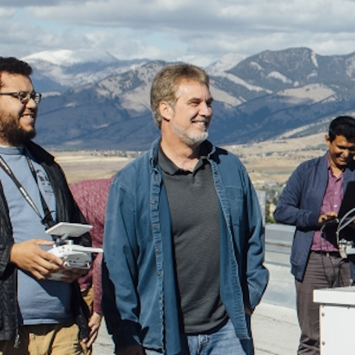 Joe Shaw, second from left, on the roof of MSU’s Cobleigh Hall in September 2018. (Image credit: Adrian Sanchez-Gonzalez/MSU)