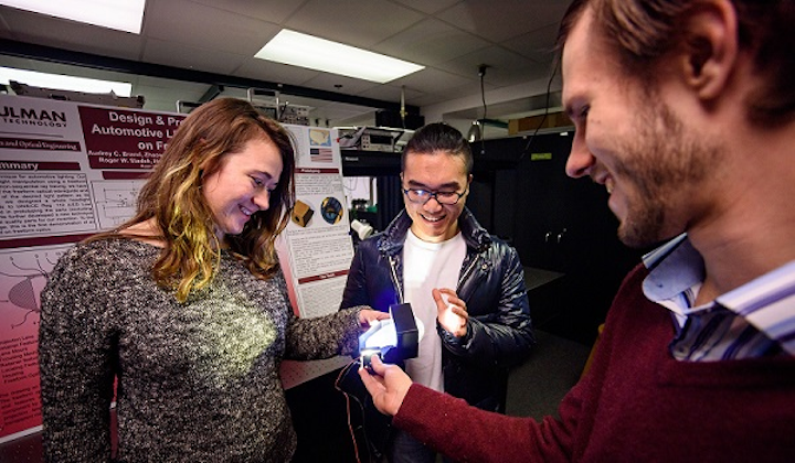 Using freeform optics to redesign automotive LED headlights earned first-place honors at the 2018 Global Capstone Design Fair in South Korea. Team members (from left) are Audrey Brand, Zhaowei Chen, and Simon Tsaoussis. Not pictured is Husam Altoonisi. (Image credit: Rose-Hulman Institute of Technology)