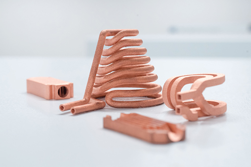 3D-printed components made of pure copper are shown.