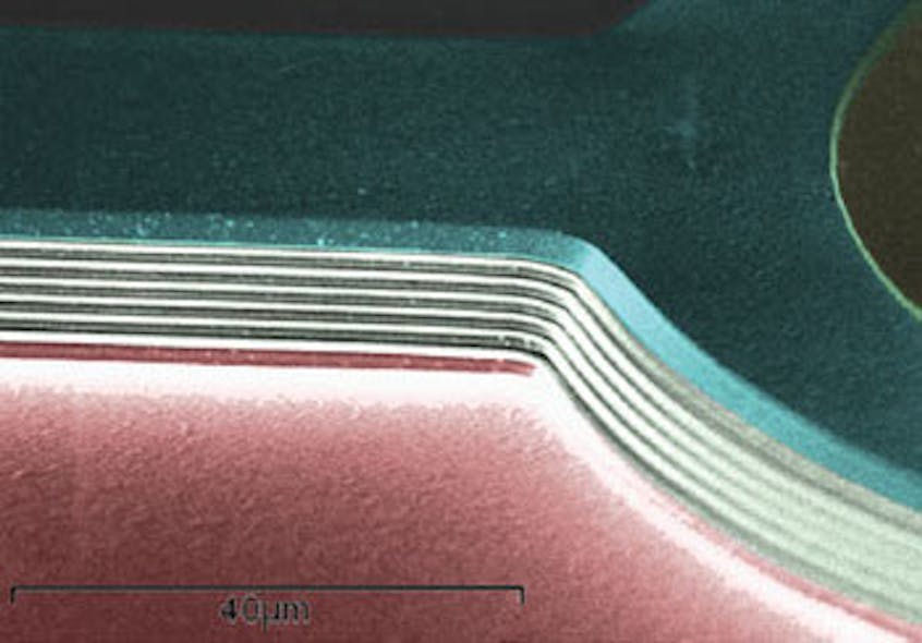 A colorized, zoomed-in scanning-electron micrograph (SEM) image shows an air-gapped distributed Bragg re&fllig;ector (DBR) sandwiched by two channels.