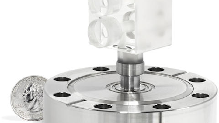 The compact FLOC cavity, only about 2.5 cm long, at the heart of the new portable prototype. This image reveals the two physical channels used for the pressure measurement. When connected to the rest of the FLOC system, one channel is kept in vacuum and the other channel is filled with a gas whose pressure is being measured. (Image credit: MKS)