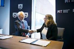Henk van Houten, global head of Philips Research, and MIT Associate Provost Karen Gleason at a signing ceremony that created a new research alliance.