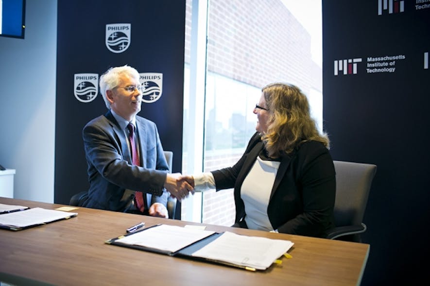 Henk van Houten, global head of Philips Research, and MIT Associate Provost Karen Gleason at a signing ceremony that created a new research alliance.