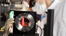 Eduardo Granados, a laser scientist at SLAC, inspects the Ti:sapphire gain crystal at the heart of SLAC's newly upgraded high-power laser system. Eduardo Granados, a laser scientist at SLAC, inspects the Ti:sapphire gain crystal at the heart of SLAC's newly upgraded high-power laser system.