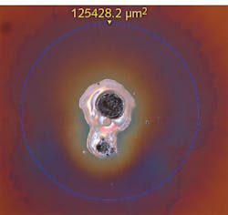 FIGURE 1. Shown is an example of laser-induced damage on the surface of an optic imaged using differential interference contrast (DIC) microscopy. FIGURE 1. Shown is an example of laser-induced damage on the surface of an optic imaged using differential interference contrast (DIC) microscopy.