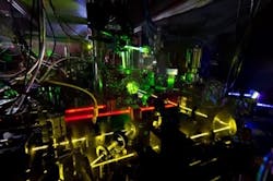 Researchers have measured the ticking of this ytterbium optical clock with record-breaking accuracy. The new work is a step toward redefining the length of a second based on time kept by an optical clock. Researchers have measured the ticking of this ytterbium optical clock with record-breaking accuracy. The new work is a step toward redefining the length of a second based on time kept by an optical clock.