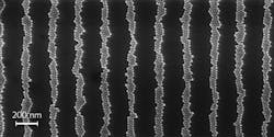 FIGURE 3. A scanning electron microscope image shows a 3300 lines/mm grating fabricated via the PTNM process using nanoparticles with a diameter = 25 nm. FIGURE 3. A scanning electron microscope image shows a 3300 lines/mm grating fabricated via the PTNM process using nanoparticles with a diameter = 25 nm.
