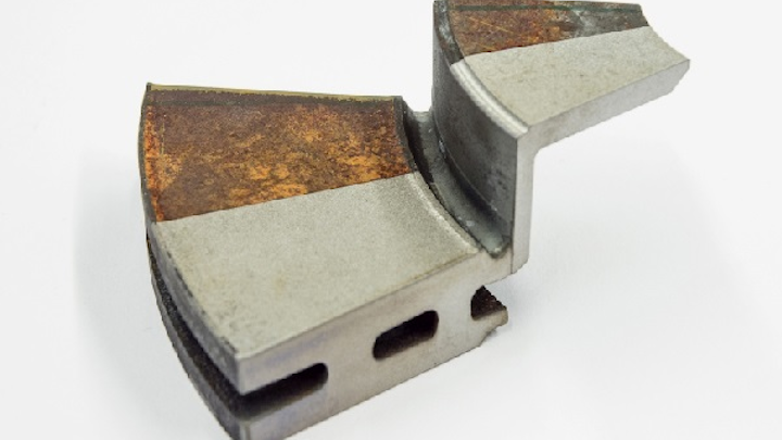 Shown is a rusty component "cleaned" with laser technology. (Image credit: TLM Laser)
