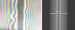 FIGURE 2. Two glass substrates, seen from the top, have been welded by a femtosecond laser, leaving four vertical weld lines surrounded by optical fringes; the inset shows a closeup of one of the lines showing weld width of 100 μm. FIGURE 2. Two glass substrates, seen from the top, have been welded by a femtosecond laser, leaving four vertical weld lines surrounded by optical fringes; the inset shows a closeup of one of the lines showing weld width of 100 μm.
