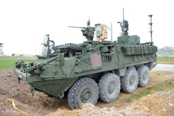 FIGURE 3. This MEHEL-equipped Stryker shot down fixed and rotary-wing drones with a 5 kW fiber laser in April 2017 during exercises at Fort Sill, NJ, a first for the Army. The beam director is in the tan box atop the truck, with a conventional gun in front. The laser is in the armored section under the beam director. (Photo credit: U.S. Army/C. Todd Lopez, Army News Service)