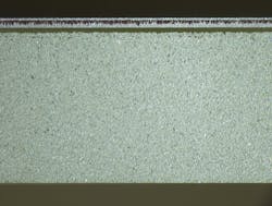 FIGURE 3. An example of mixed material cutting shows an edge view of 20 µm of polyimide on 0.5 mm glass, cut with a Coherent Monaco femtosecond laser with 40 W of average power and a pulse width ~350 fs; the surface roughness was <350 nm, as measured with an atomic force microscope. FIGURE 3. An example of mixed material cutting shows an edge view of 20 µm of polyimide on 0.5 mm glass, cut with a Coherent Monaco femtosecond laser with 40 W of average power and a pulse width ~350 fs; the surface roughness was <350 nm, as measured with an atomic force microscope.