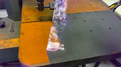 Laser Photonics' 2000 W handheld laser cleaner removes rust from a surface.