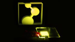 The first prototype of a new single-layer OLED developed in Mainz, Germany illuminates the logo for its developer, the Max Planck Institute for Polymer Research, MPI-P.