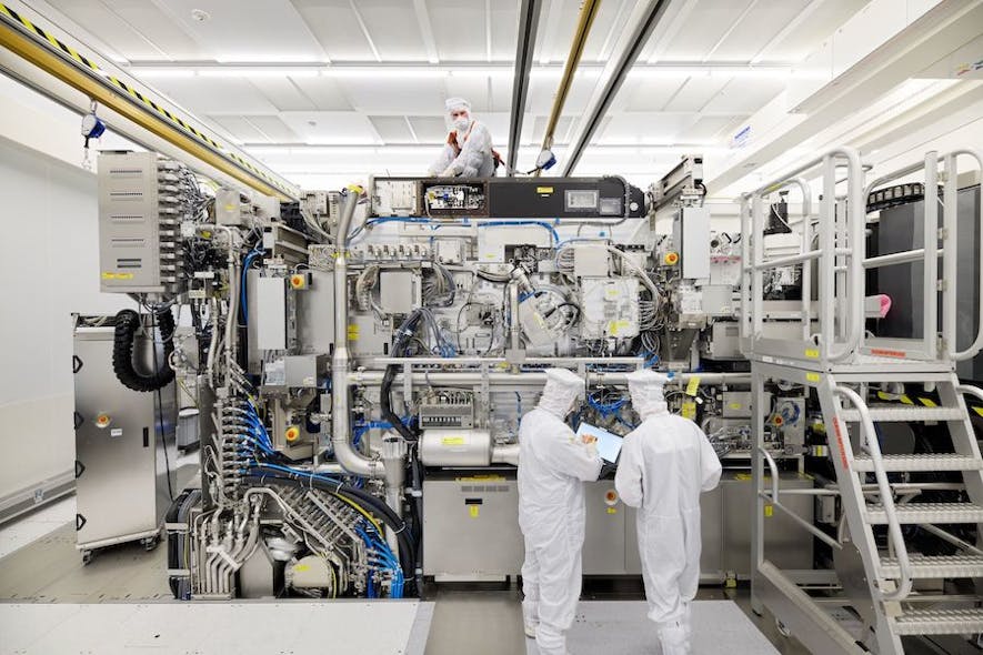 ASML employees work on the final assembly of an NXE:3400B without its panels.