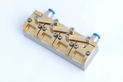 FIGURE 4. A 1 kW module made from four diode bars has a footprint of only 10 × 5 cm. FIGURE 4. A 1 kW module made from four diode bars has a footprint of only 10 × 5 cm.