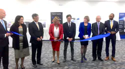 As representatives of Energetiq Technology and Hamamatsu (which acquired Energetiq in 2017) look on, Debbie Gustafson, CEO of Energetiq, cuts the ribbon in the grand opening ceremony for the company's new facility in Wilmington, MA.