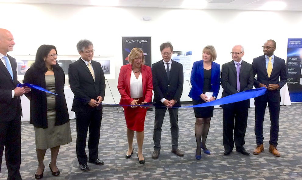 As representatives of Energetiq Technology and Hamamatsu (which acquired Energetiq in 2017) look on, Debbie Gustafson, CEO of Energetiq, cuts the ribbon in the grand opening ceremony for the company&apos;s new facility in Wilmington, MA.