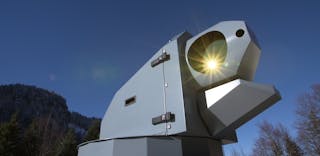A laser effector (laser system including packaging, beam steering, etc.) created by Rheinmetall. Such an effector can be used with the 20 kW spectrally beam-combined laser source made up of fiber lasers from NKT Photonics.