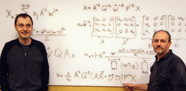 Vladimir Sukhoy (left) and Alexander Stoytchev (right), with the derivation for the ICZT algorithm in structured matrix notation -- the answer to a 50-year-old puzzle in signal processing.