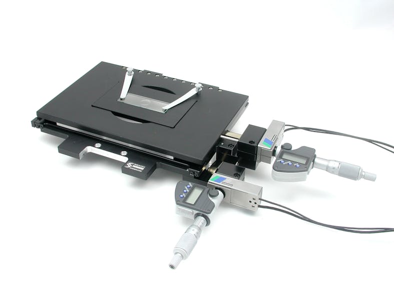 FIGURE 1. The MICI80-KMI53 microscopy stage from Piezosystem Jena, available in both open- and closed-loop versions, can be used for positioning or scanning with sub-nanometer resolution. The ultrastiff flexure design drives the digital micrometer heads with a resolution of 1 &micro;m, a manual range of motion of 25 mm in the x-y axes, and a piezo-based range of motion of 80 &micro;m. A proprietary frame design links the x-y axes in a single piece of metal for superior orthogonality and flatness. A special coil spring system delivers a constant force throughout the manual travel range of the stage, allowing preload optimization over the entire range of travel for extremely low drifting behavior.