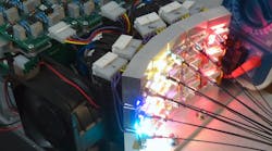 Coupling discrete LEDs to individual fibers (which are then bundled together) creates a multicolor output that can be spatially homogenized with very low loss with help from an integrating rod; this 15-emitter prototype is a precursor to FiberTech Optica’s current 18-emitter light engine. Coupling discrete LEDs to individual fibers (which are then bundled together) creates a multicolor output that can be spatially homogenized with very low loss with help from an integrating rod; this 15-emitter prototype is a precursor to FiberTech Optica’s current 18-emitter light engine.