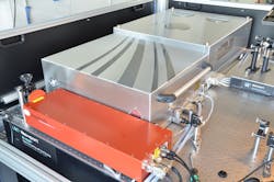 FIGURE 3. The ytterbium Innoslab master oscillator power amplifier (MOPA) comprises a commercial femtosecond seeder (left), 500 W power amplifier (center), and frequency converter to 515 nm (right). FIGURE 3. The ytterbium Innoslab master oscillator power amplifier (MOPA) comprises a commercial femtosecond seeder (left), 500 W power amplifier (center), and frequency converter to 515 nm (right).