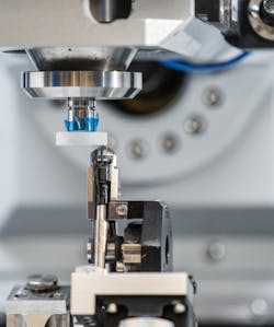 FIGURE 2. A 10 mm wheel raster polishes a 20-mm-diameter plano optic. FIGURE 2. A 10 mm wheel raster polishes a 20-mm-diameter plano optic.
