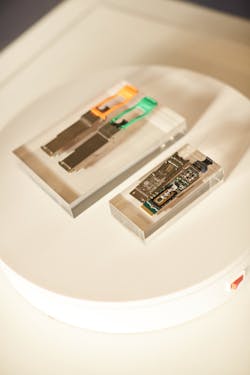 FIGURE 2. Cisco pluggable modules convert signals from electronic form into optical form, with one end accepting electrical input and delivering optical output. The photo shows the modules with and without their covers. FIGURE 2. Cisco pluggable modules convert signals from electronic form into optical form, with one end accepting electrical input and delivering optical output. The photo shows the modules with and without their covers.