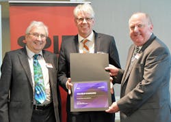David Andrews, president-elect of SPIE (left), and John Greivenkamp, president of SPIE (right), presented the award to Wilhelm Kaenders (middle).