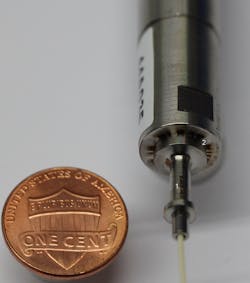 FIGURE 1. Less than 0.1 µm shift perpendicular to the device axis are achieved for the fiber coupling of a blue laser diode. Less critical penetration welds on the sleeve and ferrule (1) are followed by the precision fillet welds between sleeve flange and housing (2). Three weld optics symmetrically oriented under 120° produce weld spots with 200 µm diameter and ensure balanced introduction of minimum energy. FIGURE 1. Less than 0.1 µm shift perpendicular to the device axis are achieved for the fiber coupling of a blue laser diode. Less critical penetration welds on the sleeve and ferrule (1) are followed by the precision fillet welds between sleeve flange and housing (2). Three weld optics symmetrically oriented under 120° produce weld spots with 200 µm diameter and ensure balanced introduction of minimum energy.