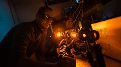 This diamond Raman laser produced by researchers at Macquarie University is pumped with light at 1018 nm to produce a 1178 nm output, which is then frequency-doubled to the 589 nm yellow sodium line. Used to produce guide stars in the upper atmosphere for adaptive optical systems in large ground-based telescopes, such a laser can do so at higher efficiency than existing lasers.