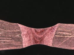 FIGURE 4. Shown in cross-section, 40 10-µm-thick copper foils are welded together using blue laser light. FIGURE 4. Shown in cross-section, 40 10-µm-thick copper foils are welded together using blue laser light.